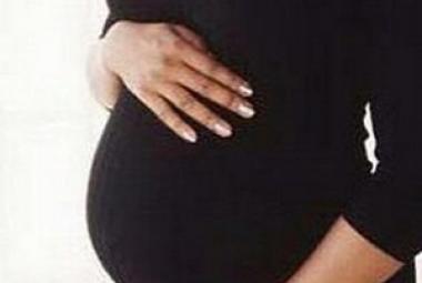 Pregnant woman in black