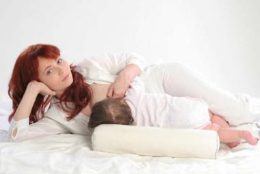 Woman on side breastfeeding