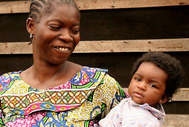 Woman smiling at baby